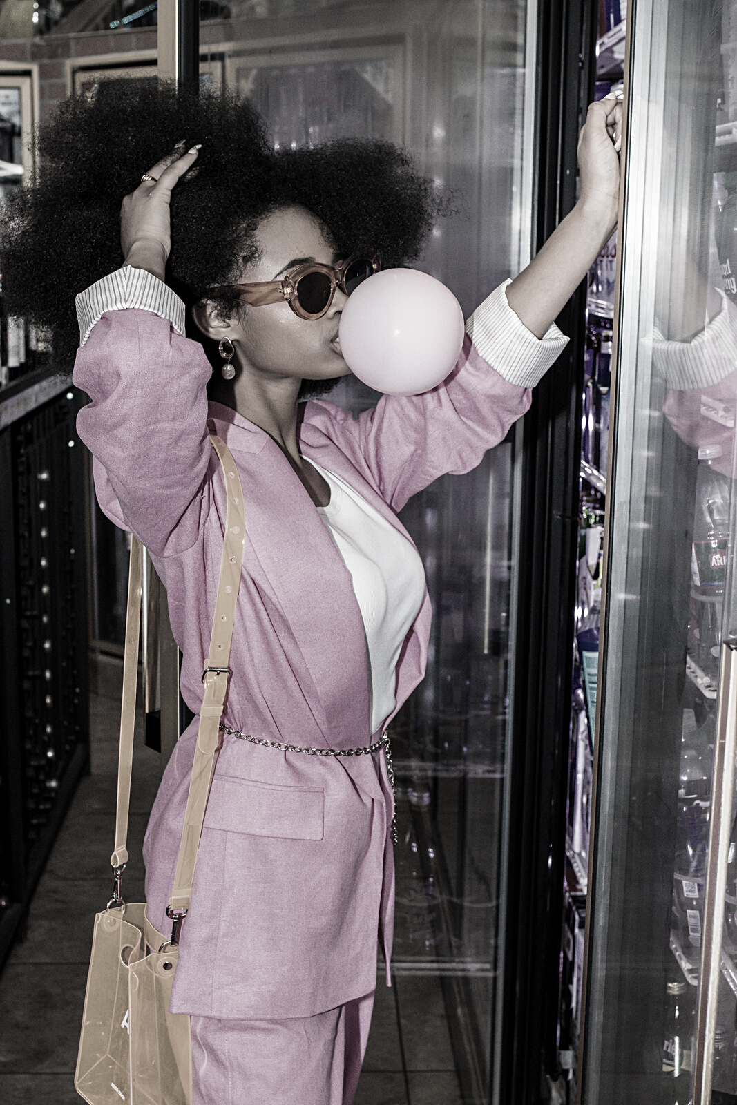 Stylish Woman with Bubble Gum at a Grocery Store